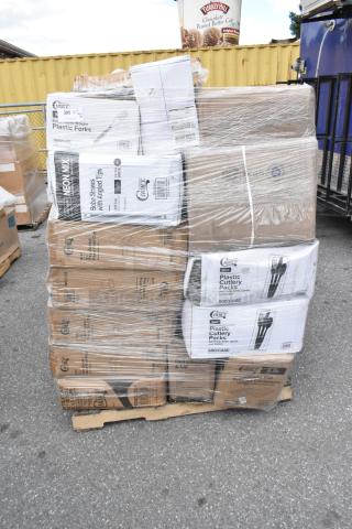 Pallet with boxed, brand new Choice cutlery packs, boba straws, and deli containers wrapped in clear plastic.