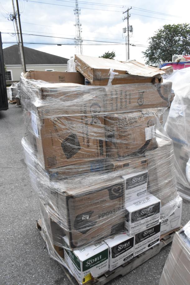 Pallet of 38 scratched and dented items, including to-go containers, T-shirt bags, cutlery sets, and paper towels, wrapped in plastic.