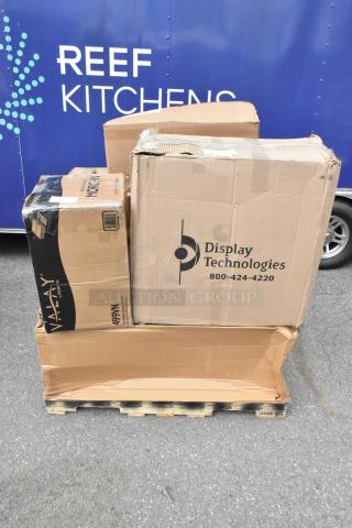 Cardboard boxes on pallet, labeled "Display Technologies" and "VALAY by MORCON." New, scratch, and dent items including organizer.