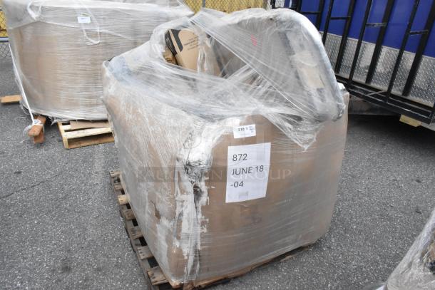 Pallet of mixed brand new scratch and dent items, wrapped, including cups and boxes. Labels show "872 JUNE 18 -04" and "310 Qty 1."