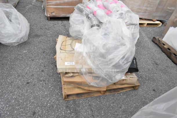 Palette of brand new, scratch and dent items wrapped in plastic, including Lavex ice buckets and Choice deli containers, on asphalt.