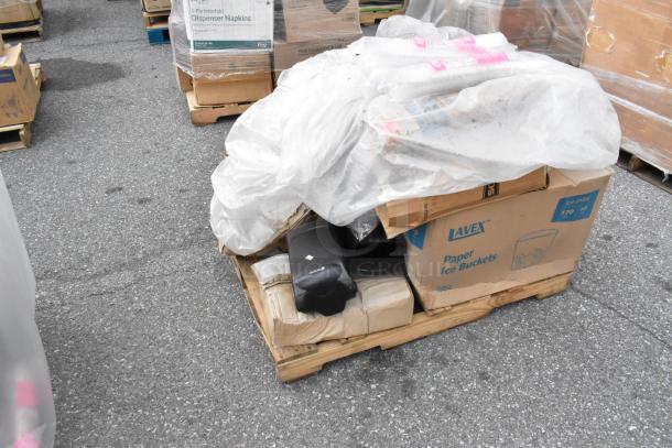 Pallet with Lavex paper ice buckets and mixed packaging, covered with white tarp, showing scratch and dent condition.