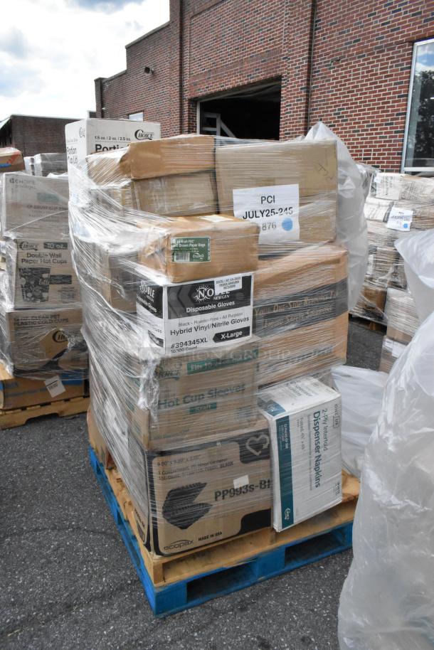 Pallet with assorted scratch and dent items including towel rolls, paper plates, cold cups, trash bags, and food trays. Boxes wrapped in plastic.