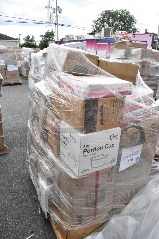 Bulk lot of 22 new scratch and dent items, including paper towels, portion cups, and table covers, in wrapped pallets.