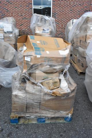 Stack of boxed items, shrink-wrapped on a pallet, labeled "Scratch and Dent." Includes table bases and plates. New condition.