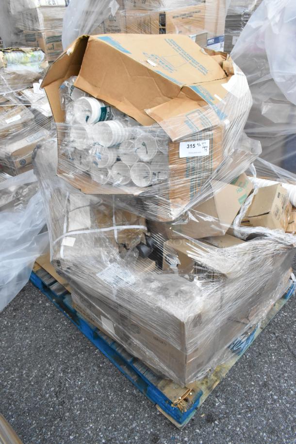 Pallet of 13 new scratch and dent items, including table bases and plates, wrapped in plastic. Visible tags indicate quantity.