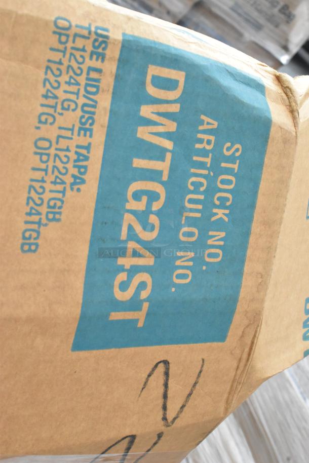 Cardboard box labeled "Articulo No. DWTG24ST," containing new scratch and dent items such as table bases and plates.