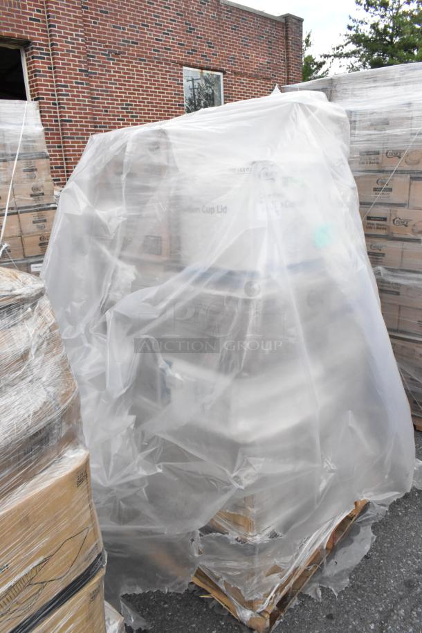 Pallet of assorted new scratch and dent items wrapped in plastic, including foam cups, containers, and more.