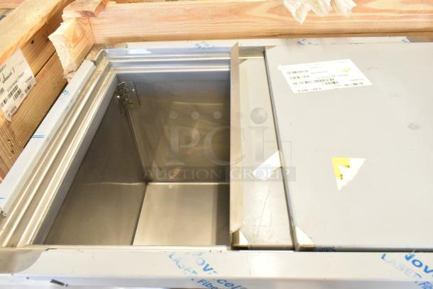 New 2021 BKI 52473-1 stainless steel commercial meat freezer, on casters, 115 volts, 1 phase. Tags indicate model and specs.