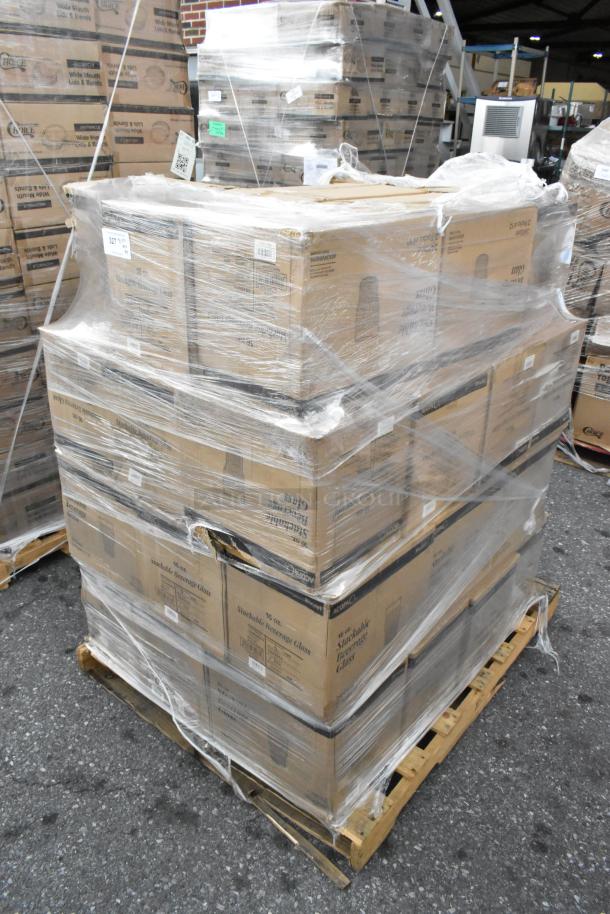 39 new boxes of Acopa Rivulet 14 oz. stackable beverage glasses, 12 per pack, on a pallet with protective wrap.