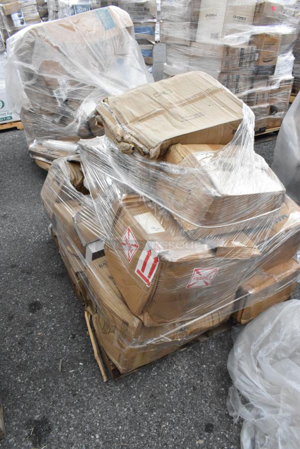 23 new scratch and dent items on pallets, wrapped in plastic. Includes glasses, stock pot, air pot, plates, and casters.