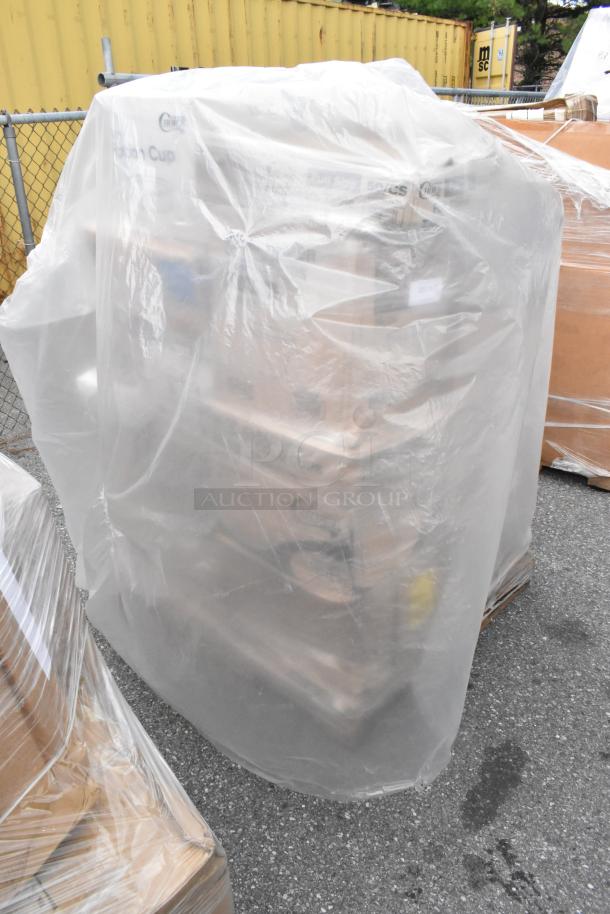 Pallet of 35 new scratch and dent items, including trash bags, plates, lids, containers, and cups, wrapped in plastic.