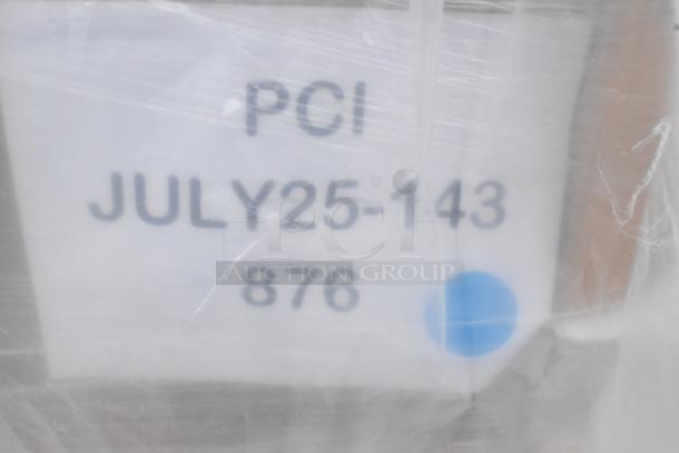 Plastic-wrapped item with label showing "PCI JULY25-143 876" and a blue dot. Part of a lot of 35 new scratch and dent items.