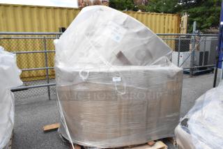 Pallet of 20 scratch and dent items wrapped in plastic, including booths. New condition. Auction lot with labeled package.