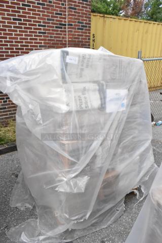 Wrapped pallet of 32 brand new scratch and dent items, including containers, gloves, napkins, and cups, ready for auction.