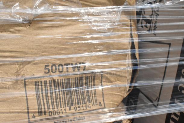Plastic-wrapped box labeled "500TW7," barcode visible, containing scratch and dent items like towels and napkins. Made in China.