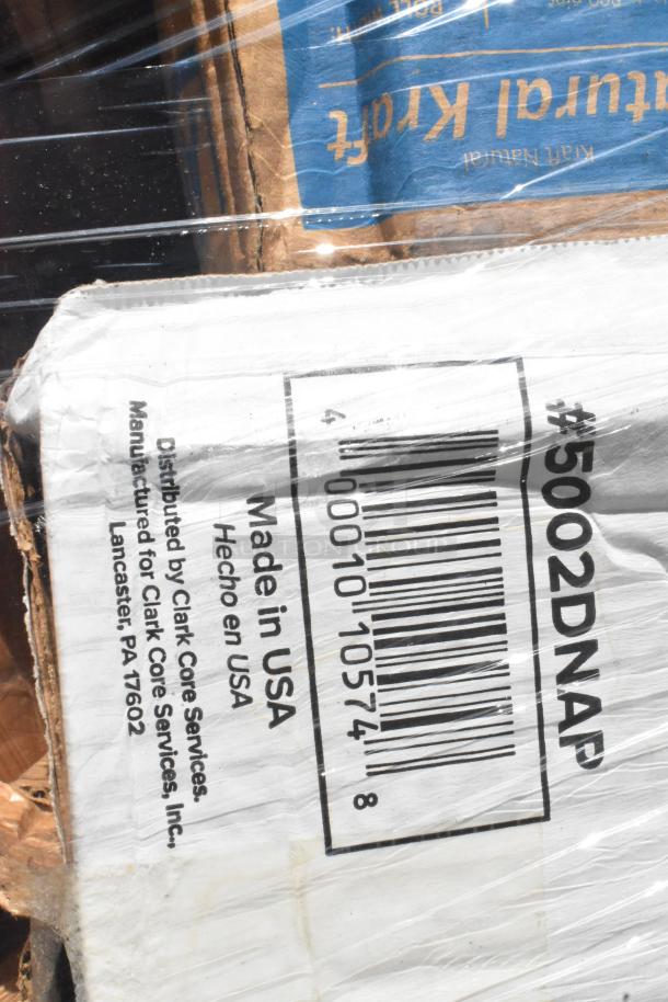 Close-up of a boxed item with visible label. Label shows barcode, "#5002DNAP", "Made in USA", distributed by Clark Core Services.