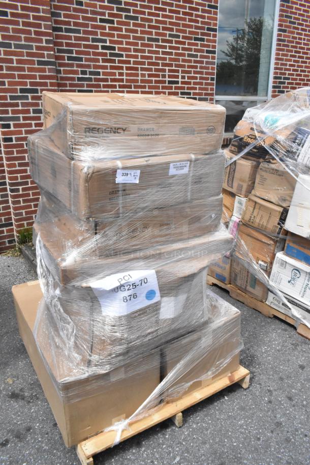 Pallet with boxes labeled "Regency Drawer" wrapped in plastic. Contains 8 scratch and dent items: cheese melter, mop sink, stanchion.