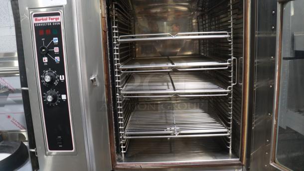 MARKET FORGE MFC-101 S/AA electric combi steamer with stainless steel racks and control panel, in good condition.