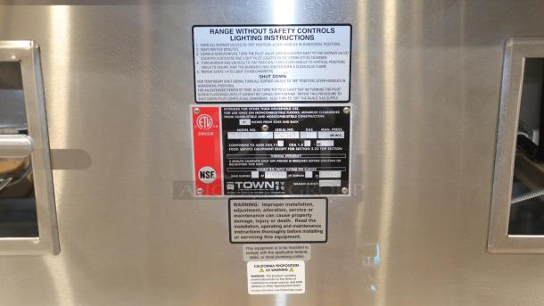 BRAND NEW Town Y-2-SS-N York™ Two Chamber Natural Gas Wok Range with safety instructions and warnings visible.