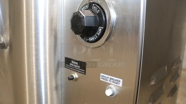 American Metal Ware 7776E coffee urn, stainless steel, twin 6-gallon capacity, manual operation label, circuit breaker reset.
