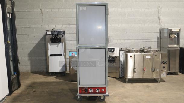 Avantco HPI-1836 heated holding cabinet, clear door, 120V, features temperature controls, on wheels for mobility, excellent condition.