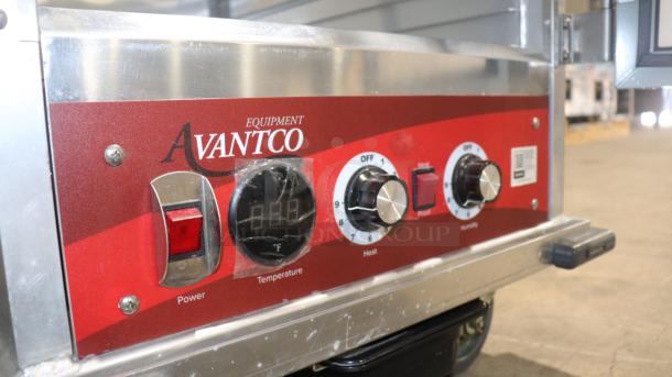 Avantco HPI-1836 heated holding cabinet control panel with temperature, heat, and humidity dials, and power switch visible.