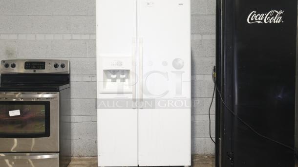 KENMORE Model 106.53502300 side-by-side refrigerator with cold water dispenser, white finish, overall good condition.