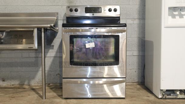 Kenmore stove model C648433, stainless steel, used condition, front controls, visible label with number 13.