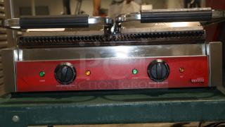 Avantco 177P84 double grooved panini press in very good condition, 120V, red control panel with temperature knobs, tested working.