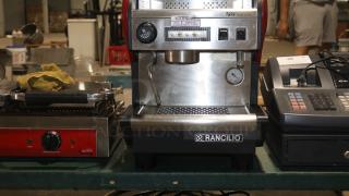 RANCILIO S27 commercial espresso machine, stainless steel, 1 group, automatic, 115V, labeled warning: "hot liquid, handle with care."