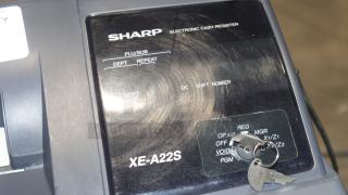 Sharp XE-A22S cash register in used condition, featuring control panel with keys. Dimensions: 14x14x12 inches.
