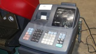 Sharp XE-A22S cash register, 14x14x12 inches, with keypad and display, includes key, good condition for auction.
