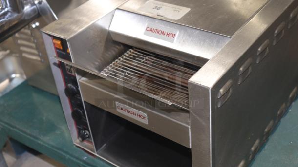 Wyott AT-10 Conveyor Toaster, used excellent condition, 208/240V. Tested & working. "Caution Hot" labels visible.