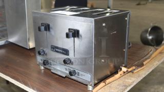 TOASTSWELL NBT4-L 4-slice electric toaster, stainless steel, visible controls and slots, good condition.