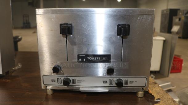 TOASTSWELL NBT4-L 4-slice electric toaster in good condition, featuring wide and regular slots, stainless steel finish.