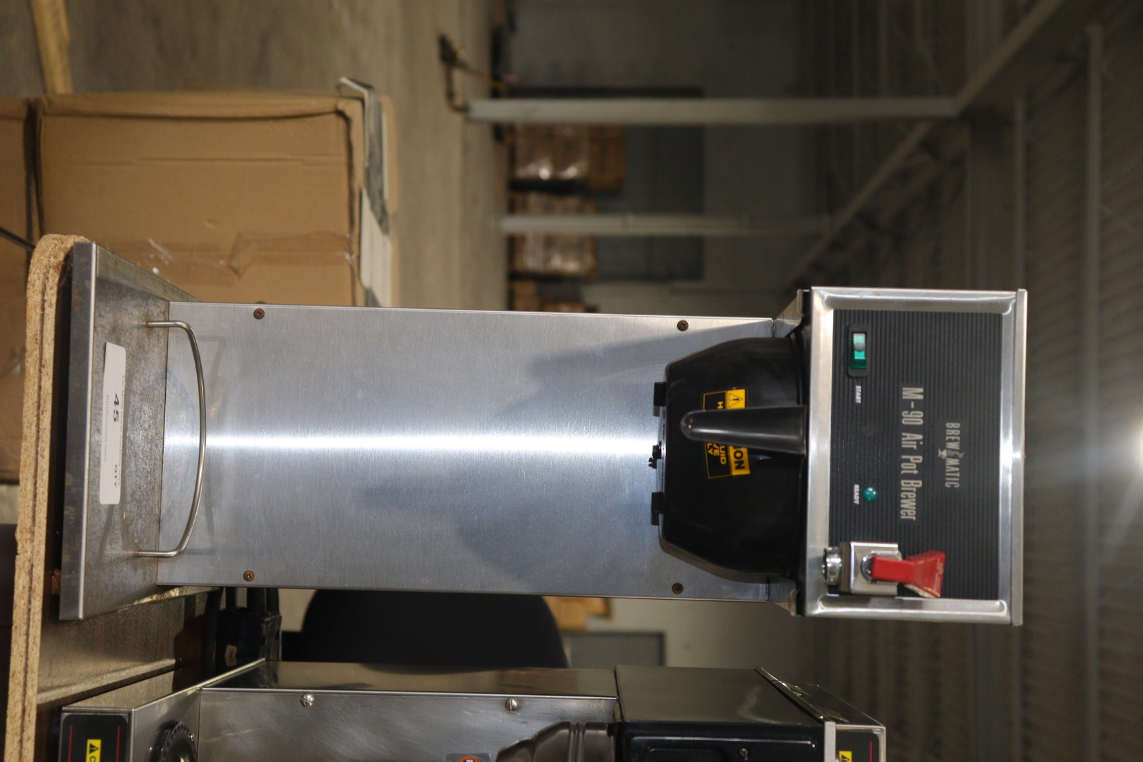 Commercial airpot coffee brewer showing brew head and station