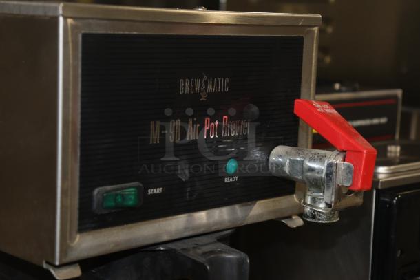 Brewmatic M-90 Air Pot Brewer, stainless steel, featuring start and ready buttons, with visible wear, for auction.