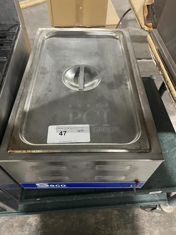SESCO CW-1200 stainless steel warmer. Slightly worn with label showing "47 QTY" from PCI Auctions.