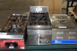 ANETS burner with dual cast iron grates and stainless steel front. Visible ANETS logo plate. Some wear shown.