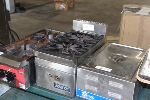 ANETS burner, stainless steel, dual knob controls. Visible ANETS branding. Good condition with minor wear.
