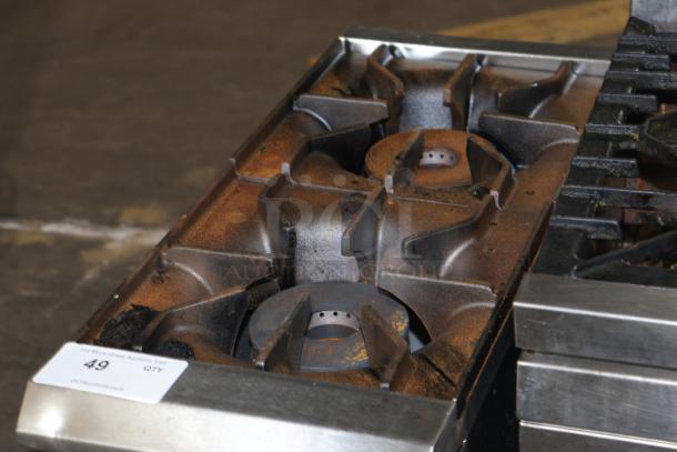 Avantco Chef Series CAG-R-2-12 2 Burner, used, visible rust and wear, metal construction, auction tag visible.