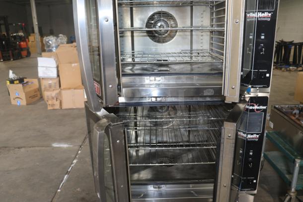 Blodgett HVH-100E commercial oven, silver, dual fans, multiple racks, visible control panels, in used condition.
