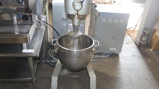Hobart D300 30 Qt Dough Mixer; industrial-grade, metal body, used condition; includes mixing bowl and attachments.