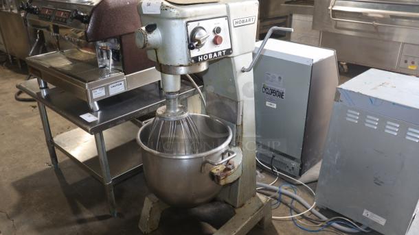 Hobart D300 30 Qt dough mixer with whisk attachment, worn exterior, visible rust, functional controls, sturdy base.