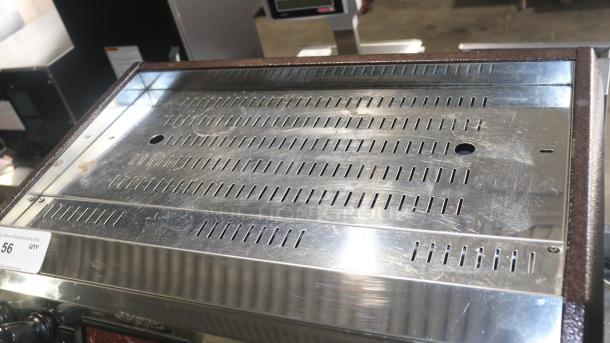 Grindmaster-Cecilware ESP2-220V Venezia II espresso machine top view; stainless steel surface with vent slots and item tag, in used condition.