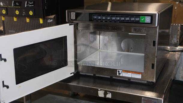 Amana HDC1015 commercial microwave, stainless steel, 1000W, 120V, push button controls, open door view, excellent condition.