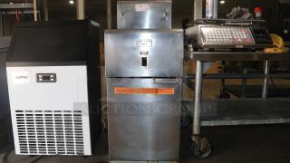 DEAN SR14E Super Runner Electric Fryer, stainless steel, visible "Caution Hot" sign, slight wear, auction item.