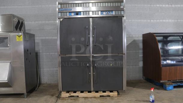 VICTORY commercial fridge, double-door, stainless steel, with temperature gauges. Used condition, visible wear.