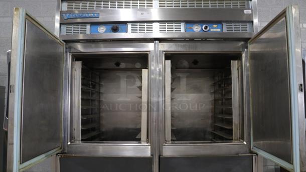 Commercial fridge by Victory, double-door, stainless steel, internal shelving, visible gauges, fair condition.